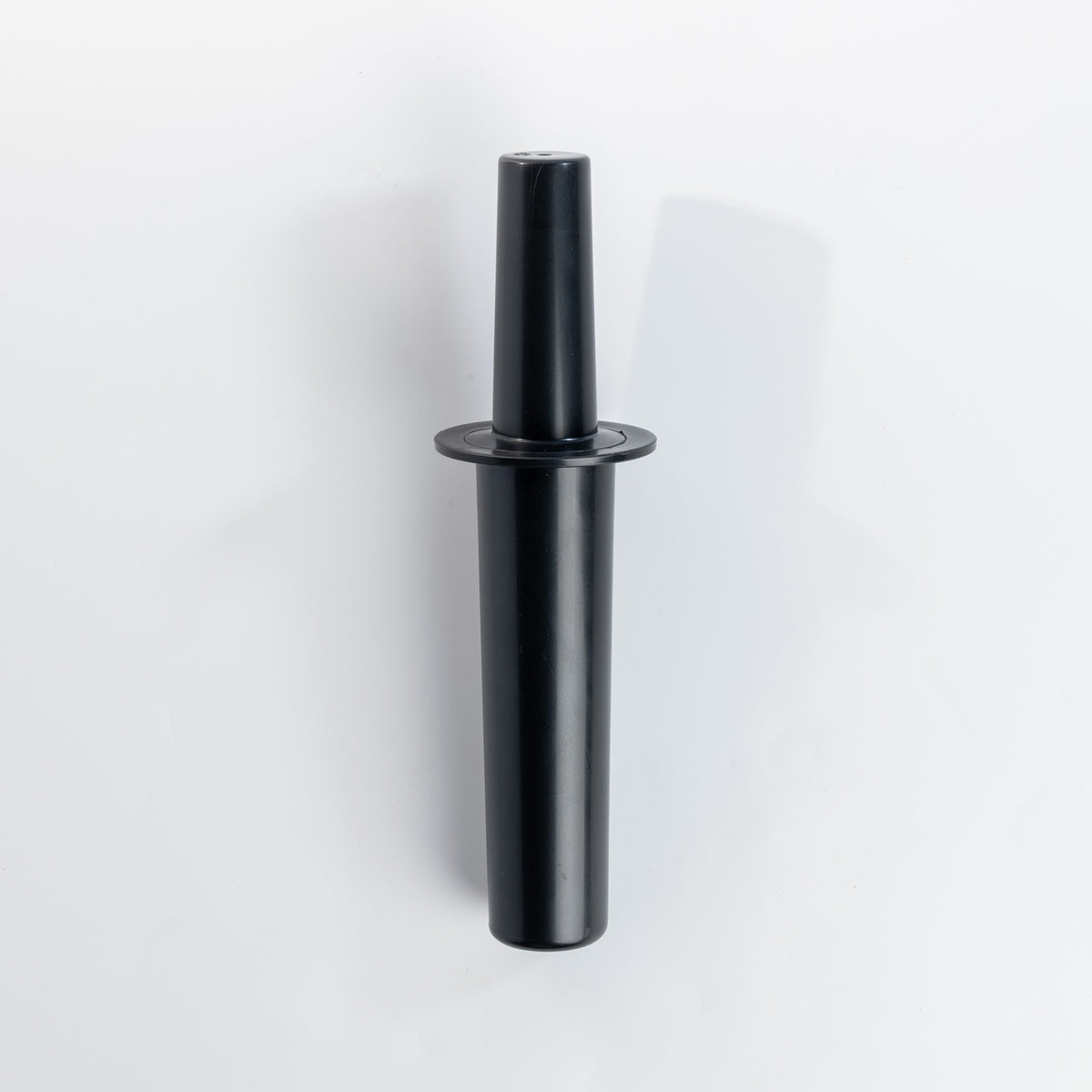 The black VOID tamper standing upright on a white background