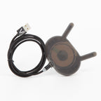 VOID wireless charger with its black braided magnetic USB cable