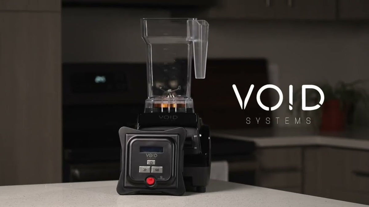 The VOID Complete System on a kitchen counter with the VOID vacuum lid standing in front of it
